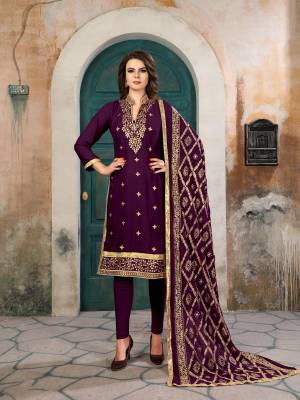 Add This Neew And Unique Shade To Your Wardrobe With This Semi-Stitched Suit In Wine Colored Top Paired With Wine Colored Bottom And Dupatta. Its Top Is Fabricated On Georgette Paired With Santoon Bottom And Chiffon Dupatta. It Is Beautified With Heavy Embroidery All Over Its Top And Dupatta.