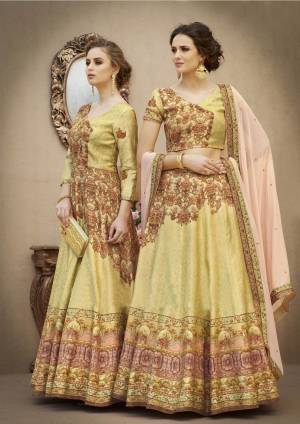 New And Unique Shade Is Here With This Designer Lehenga Choli In Pear Green Colored Blouse Paired With Pear Green Colored Lehenga And Contrasting Baby Pink Colored Dupatta. Its Blouse And Lehenga Are Fabricated On Banarasi Art Silk Paired With Chiffon Dupatta. Buy This Two-In-One Dress Which Can Also Be Stitched As Gown By Joining Its Yoke And Lehenga.