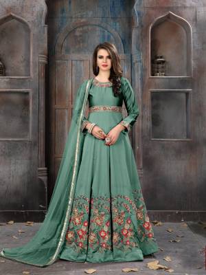 Add This New Shade In Green To Your Wardrobe With This Designer Floor Length Suit In Teal Green Color Paired With Teal Green Colored Bottom And Dupatta. Its Top Is Fabricated On Art Silk Paired With Santoon Bottom And Net Dupatta. This Suit Is Light Weight And Easy To Carry All Day Long. Buy Now.