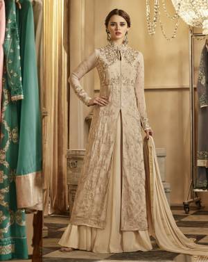 Simple And Elegant Looking Designer Indo-Western Suit Is Here In Beige Colored Top Paired With Beige Colored Bottom And Dupatta. Its Top And Lehenga Are Fabricated On Georgette Paired With Santoon Bottom And Chiffon Dupatta. This Suit Is Light Weight And Easy To Carry All Day Long.