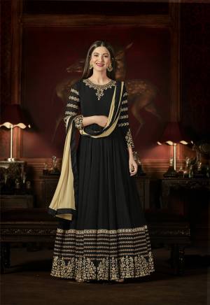Enhance Your Beauty Wearing This Deisgner Floor Length Suit In Black Color Paired With Black Colored Bottom And Beige Colored Dupatta. Its Top Is Fabricated On Georgette Paired With Santoon Bottom And Chiffon Dupatta. It Is Light Weight And Ensures Superb Comfort Throughout The Gala.