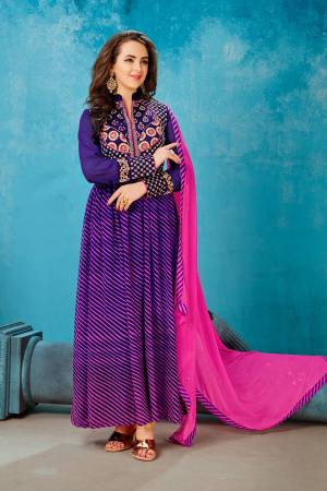 Add This Attractive Suit To Your Wardrobe In Violet Color Paired With Violet Colored Bottom And Contrasting Pink Colored Dupatta. Its Top Is Fabricated On Georgette Paired With Santoon Bottom And Chiffon Dupatta. This Suit Is Beautified With Prints And Embroidery. It Is Light Weight And Easy To Carry All Day Long.