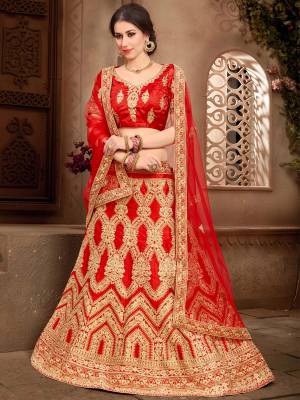 Grab This Beautiful Heavy Designer Lehenga For The Upcoming Wedding Season. This Bright And Appealing Red Colored Lehenga Choli Paired With Red Colored Dupatta Will Make You Earn Lots Of Compliments From Onlookers. Its Blouse And Lehenga Are Fabricated On Art Silk Paired With Net Fabricated Dupatta. Its Has Heavy Jari Embroidery All Over It. Buy This Designer Lehenga Choli Now.
