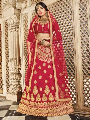 Adorn A Queen Like Look Wearing This Designer Lehenga Choli In Maroon Color Paired With Maroon Colored Dupatta. Its Blouse And Lehenga Are Fabricated On Art Silk Paired With Net Fabricated Dupatta. It Is Beautified With Jari Embroidery All Over It.