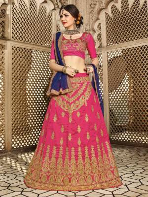 Attract All Wearing This Pink Colored Designer Lehenga Choli Paired With Contrasting Royal Blue Colored Dupatta. Its Blouse And Lehenga Are Fabricated On Art Silk Paired With Net Fabricated Dupatta. It Is Beautified With Jari Embroidery All Over It. Buy This Lehenga Choli Now.