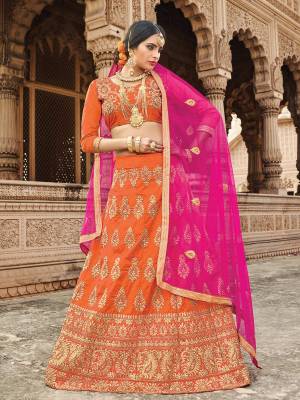 Orange Color Induces Perfect Summery Appeal To Any Outfit, So Grab This Designer Lehenga Choli In Orange Color Paired With Contrasting Pink Colored Dupatta, This Lehenga Choli Is Fabricated On Art Silk Paired With Net Fabricated Dupatta. All Its Fabrics Ensures Superb Comfort All Day Long. Buy Now.