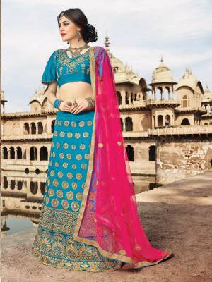Look Pretty In This Blue Colored Designer Lehenga Choli Paired With Contrasting Dark Pink Colored Dupatta. Its Lehenga And Choli Are Fabricated On Art Silk Paired With Net Fabricated Dupatta. It Is Light Weight And Easy To carry All Day Long, Buy Now.