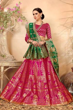 Bright And Visually Appealing Color Is Here With This Magenta Pink Colored Lehenga Choli Paired With Contrasting Green Colored Dupatta.This Whole Lehenga Choli And Dupatta Are Fabricated On Jacquard Silk Beautified With Weave. Buy Now.