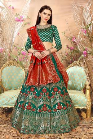 Add This Lovely Shade In Green With This Lehenga Choli In Pine Green Color Paired With Contrasting Red Colored Dupatta. Its Blouse, Lehenga And Dupatta Are Fabricated On Jacquard Silk Beautified With Weave. It Is Light Weight And Ensures Superb Comfort All Day Long.