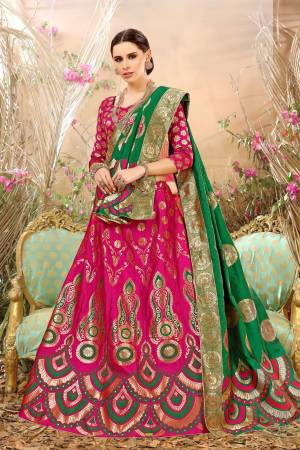 Bright And Visually Appealing Color Is Here With This Magenta Pink Colored Lehenga Choli Paired With Contrasting Dark Green Colored Dupatta.This Whole Lehenga Choli And Dupatta Are Fabricated On Jacquard Silk Beautified With Weave. Buy Now.