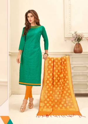 Here Is A Bright Combination In Dress Material With This Teal Green Colored Top Paired With Contrasting Orange Colored Bottom And Dupatta. Its Top Is Fabricated On Glace Cotton Paired With Cotton And Banarasi Art Silk Dupatta. Buy Now.