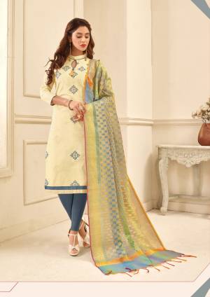 Simple, Elegant And Rich Looking Straight Cut Suit Is Here With This Dress Material In Cream Colored Top Paired With Grey Colored Bottom And Multi Colored Dupatta. Its Top IS Fabricated On Glace Cotton Paired With Cotton Bottom And Banarasi Art Silk Dupatta. 