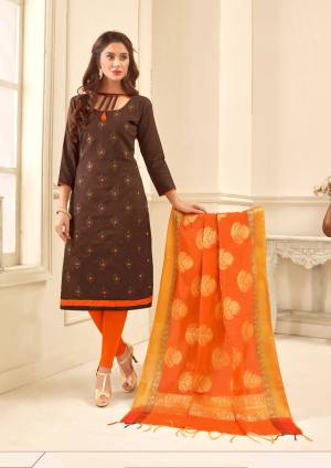For Your Semi-Casual Wear, Grab This Dress Material In Brown Colored Top Paired With Contrasting Orange Colored Bottom And Dupatta. Its Top Is Fabricated On Glace Cotton Paired With Cotton Bottom And Banarasi Art Silk Dupatta. This Suit Is Light In Weight And Easy To Carry All Day Long.