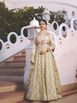 Simple and Elegant Looking Designer Floor Length Suit Is Here In Off-White Colored Top Paired With Off-White Colored Bottom And Dupatta. Its Top Is Fabricated On Art Silk Paired With Santoon Bottom And Net Dupatta. It Has Pretty Contrasting Embroidery Over The Top And Dupatta.