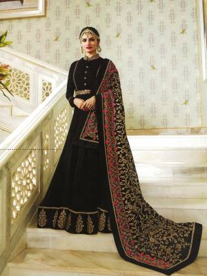 For A Bold And Beautiful Look, Grab This Designer Floor Length Suit In Black Colored Top Paired With Black Colored Bottom And Dupatta. Its Top Is Fabricated On Art silk Paired With Santoon Bottom And Chiffon Dupatta. The Main Attractive Part Of This Suit Is Its Heavy Embroidered Dupatta Which Will Definitely Earn You Lots Of Compliments From Onlookers.