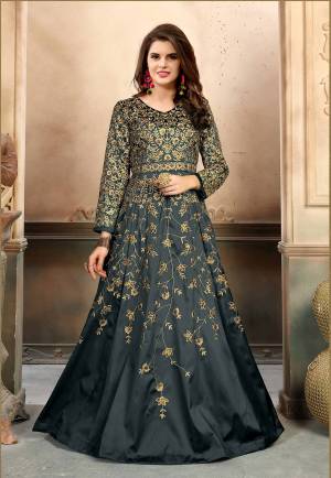 Flaunt Your Rich And Elegant Taste Wearing This Designer Floor Length Suit In Grey Color Paired With Grey Colored Bottom And Dupatta. Its Top Is Fabricated On Art Silk Paired With Santoon Bottom And Net Dupatta. It Is Beautified With Heavy Jari Embroidery And Stone Work. Its All Three Fabrics Ensures Supreb Comfort All Day Long.