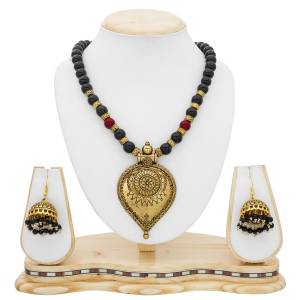 Get Ready With Your Traditonal Attire With This Beautiful Traditonal Necklace In Golden Color Beautified With Black Colored Moti. This Necklace Set Can Be Paired With A Banarasi Saree Or Lehenga For Best Look.