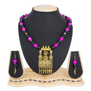 Designer Necklace Set Is Here In Pendant Pattern. It Is In Golden Color Beautified With Black And Pink Colored Motis.