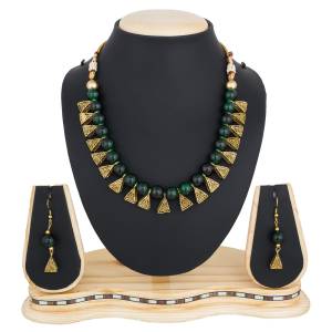 Give An Elegant Look To Your Neckline With This Beautiful Necklace Set Beautified With Dark Green Colored Motis.