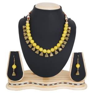 Give An Elegant Look To Your Neckline With This Beautiful Necklace Set Beautified With Yellow Colored Motis.