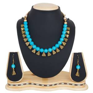 Give An Elegant Look To Your Neckline With This Beautiful Necklace Set Beautified With Blue Colored Motis.