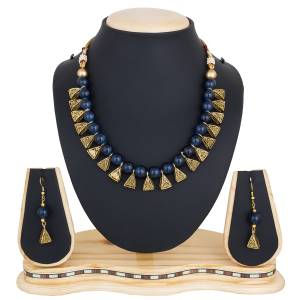 Give An Elegant Look To Your Neckline With This Beautiful Necklace Set Beautified With Navy Blue Colored Motis.