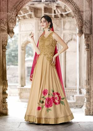 Flaunt Your Rich and Elegant Taste Wearing This Designer Floor Length Suit In Beige Colored Top Paired With Beige Colored Bottom And Contrasting Dark Pink Colored Dupatta. Its Top Is Fabricated On Art Silk Paired With Santoon Bottom And Net Fabricated Dupatta. Buy Now.