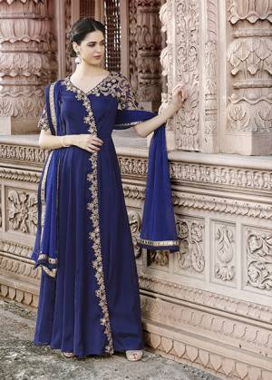 Shine Bright Wearing This Beautiful Designer Floor Length Suit In Royal Blue Color Paired With Royal Blue Colored Bottom And Dupatta. Its Top Is Fabricated On Georgette Paired With Santoon Bottom And Chiffon Dupatta. It Has Elegant Embroidery, Making The Suit More Attractive.