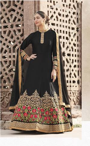 For A Bold A Beautiful Look, Grab This Designer Floor Length Suit In Black Color Paired With Black Colored Bottom And Dupatta. Its Top Is Fabricated On Satin Crepe Paired With Santoon Bottom And Net Dupatta. It Is Beautified With Contrasting Embroidery Over The Panel And Sleeves. 
