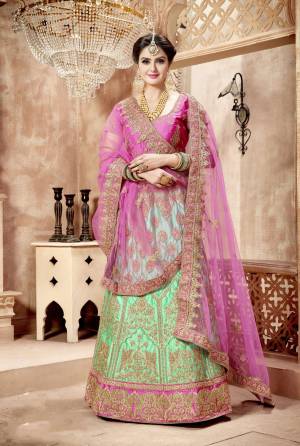 Look Pretty In This Lovely Combination Of Lehenga Choli In Pink Colored Blouse Paired With Contrasting Sea Green Colored Lehenga And One Pink Colored Dupatta And Another Sea Green Colored Dupatta. These Pretty Colors Will Definitely Earn You Lots Of Compliments From Onlookers. Buy Now.