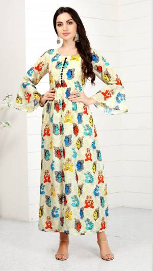 New And Unique Prints Are Here With This Readymade Kurti In Off-White Color Beautified With Unique Multi Colored Prints All Over It. It Is Available In Many Sizes. Buy Now.