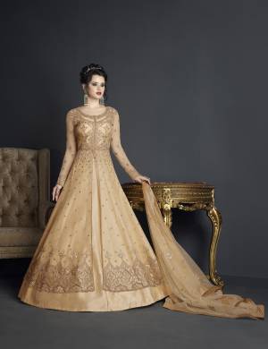 You Will Definitely Earn Lots Of Compliments Wearing This Designer Suit In Beige Color Paired With Beige Colored Bottom And Dupatta. Its Top Is Fabricated On Net Paired With Art Silk Bottom And Net Dupatta. Get This Semi-Stitched Suit Tailored As Per Your Desired Fit And Comfor. It Ensures Superb Comfort All Day Long. Buy Now.