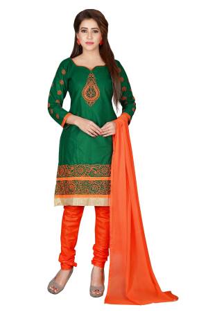 Here Is A Simple Dress Material For Your Casual Wear In Green Colored Top Paired With Contrasting Orange Colored Bottom And Dupatta. Its Top Is Fabricated On Chanderi Cotton Paired With Santoon Bottom And Chiffon Dupatta. Get This Stitched As Per Your Desired Fit And Comfort.