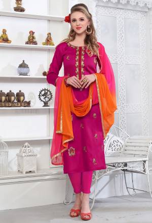 Shine Bright Wearing This Designer Straight Suit In Dark Pink Colored Top Paired With Dark Pink Colored Bottom And Orange And Pink Dupatta. Its Top Is Fabricated On Cambric Cotton Paired With Cotton Bottom And Chiffon Dupatta. Its All Three Fabrics Ensures Superb Comfort All Day Long. Buy This Dress Material Now.
