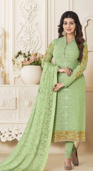 Celebrate This Festive Season Wearing This Suit In Light Green Color Paired With Light Green Colored Bottom And Dupatta. Its Top Is Fabricated On Georgette Paired With Santoon Bottom And Brasso Dupatta. It Is Light Weight And Ensures Superb Comfort All Day Long.