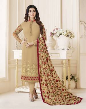 You Will Definitely Earn Lots Of Compliments Wearing This Designer Straight Cut Suit In Beige Colodr Paired With Beige Colored Bottom And Dupatta. Its Top Is Fabricated On Georgette Paired With Santoon Bottom And Brasso Dupatta. It Is Beautified With Prints And Embroidery. Buy It Now.