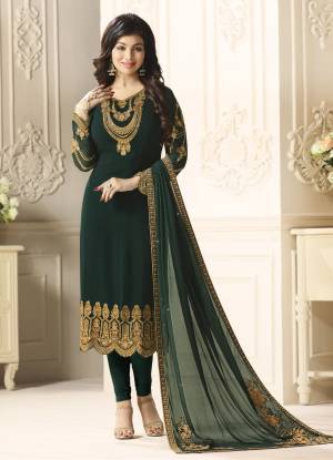 Here Is A Beautiful and Attractive Shade In Green With This Semi-Stitched Suit In Pine Green Color Paired With Pine Green Colored Bottom And Dupatta. Its Top Is Fabricated On Georgette Paired With Santoon Bottom And Chiffon Dupatta. Its Color And Fabric Will Definitely Earn You Lots Of Compliments From Onlookers.