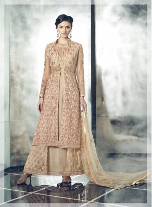 Grab The New Unique Collection In Indo-Western Suit In Beige Colored Top Paired With Beige Colored Bottom And Dupatta. Its Top Is Fabricated On Net Paired With Santoon Bottom And Net Dupatta. Additionally It Comes With A Jacket Fabricated On Net. It Has Embroidery All Over Its Fabrics. 