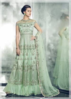 Such A Pretty Shade In Green Is Here With This Indo-Western Suit In Pastel Green Color Paired With Pastel Green Colored Bottom And Dupatta. Its Top Is Fabricated On Net Paired With Santoon Bottom And Net Dupatta. Additionally This Pretty Dress Comes With A Beautiful Cape, You Can Pair It Up As Per Your Choice And Occasion.