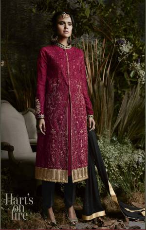Grab This Attractive Designer Suit In Maroon Colored Top Paired With Black Colored Bottom And Dupatta. Its Top Is Fabricated On Georgette Paired With Santoon Bottom And Chiffon Dupatta. It Is Beautified With Embroidery All Over The Top With Stone Work. Buy it Now.