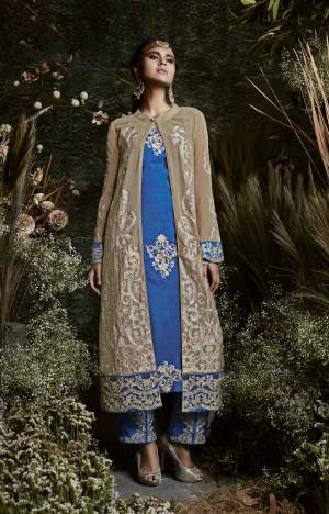 Here Is A Designer Suit In Blue And Beige Color Paired With Blue Colored Bottom And Dupatta. Its Top Is Fabricated On Georgette Paired With Santoon Bottom And Chiffon Dupatta. It Has Pretty Jacket Pattern With Embroidered Inner And Bottom.