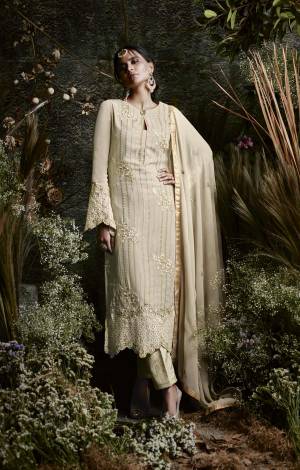Flaunt Your Rich And Elegant Taste Wearing This Designer Suit In Cream Color Paired With Cream Colored Bottom And Dupatta. Its Top Is Fabricated On Georgette Paired With Santoon Bottom And Chiffon Dupatta. It Has Very Pretty Embroidery All Over The Top With Bell Sleeve Pattern. Buy Now.