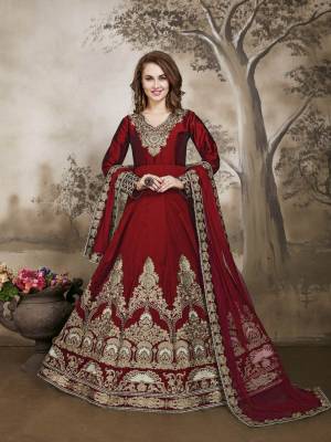 Adorn The Pretty Angelic Look Wearing This Designer Floor Length Suit In Red Color Paired With Red Colored Bottom And Dupatta. Its Top Is Fabricated On Art Silk Paired With Santoon Bottom And Net Dupatta. It Has Jari And Resham Work Making The Suit Attractive. Buy This Semi-Stitched Suit Now.