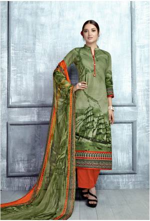 Here Is A Traditional Combination With This Dress Material In Green Colored Top Paired With Contrasting Orange Colored Bottom And Green Colored Dupatta. Its Top Is Fabricated On Cambric Cotton Paired With Cotton Bottom And Chiffon Dupatta. Buy This Dress Material Now.