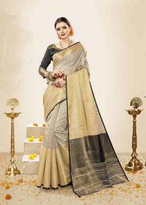 Flaunt your Rich And Elegant Taste Wearing This Rich Looking Saree In Pale Grey Color Paired With Dark Grey Colored Blouse. This Saree and Blouse Are Fabricated On Cotton Handloom Silk Beautified with Weave. Its Light Weight And Easy To carry All Day Long.