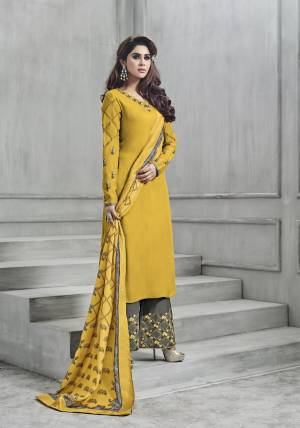 New And Unique Comboination Is Here With This Designer Readymade Suit In Yellow Colored Top Paired With Contrasting Grey Colored Bottom And Yellow Colored Dupatta. Its Top Is Fully Stitched With Unstitched Bottom. Its Top Is Fabricated On Art Silk Paired With Santoon Bottom And Muslin Dupatta. 
