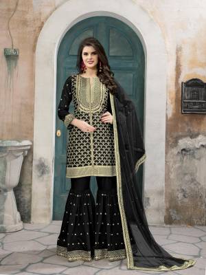 Enhance Your Beauty Wearing This Designer Sharara Suit In Black Colored Top Paired With Black Colored Bottom And Dupatta. Its Top Is Fabricated On Art Silk Paired With Art Silk Fabricated Sharara And Net Fabricated Dupatta. It Has Embroidery All Over The Three Parts. Buy Now.