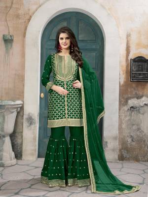 Get Ready For Your Upcoming Festive Season Wearing This Designer Sharara Suit In Green Colored Top Paired With Green Colored Bottom And Dupatta. Its Top And Sharara Are Fabricated On Art Silk Paired With Net Fabricated Dupatta. It Is Light Weight And Ensures Superb Comfort All Day Long.