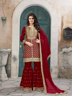 Celebrate This Festive Season wearing This Designer Sharara Dress In Red Colored Top Paired With Red Colored Bottom And Dupatta. Its Top And Bottom Are Fabricated On Art Silk Paired With Net Fabricated Dupatta. Buy This Suit Now.