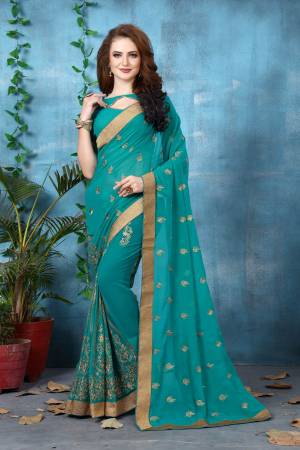 Very Pretty Shade In Blue Is Here With This Saree In Turquoise Blue Color Paired With Turquoise Blue Colored Blouse. This Saree And Blouse Are Fabricated On Georgette Beautified With Jari Embroidery All Over It. Buy Now.